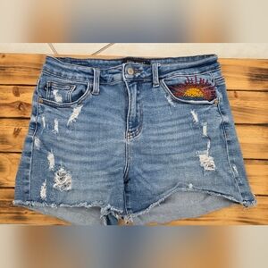 Stylish Blue Distressed Jeans with Embroidered Detail